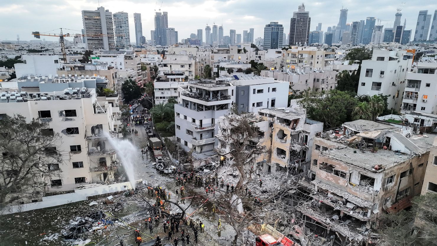 Iranian missiles targeted central Israel, causing damage and fires in multiple areas, including at least three sites in