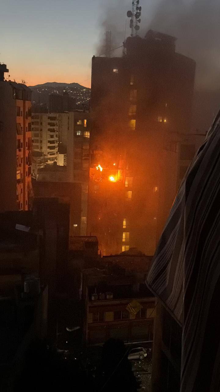 Israeli occupation aircraft bomb Beirut, sparking fire in residential apartment.