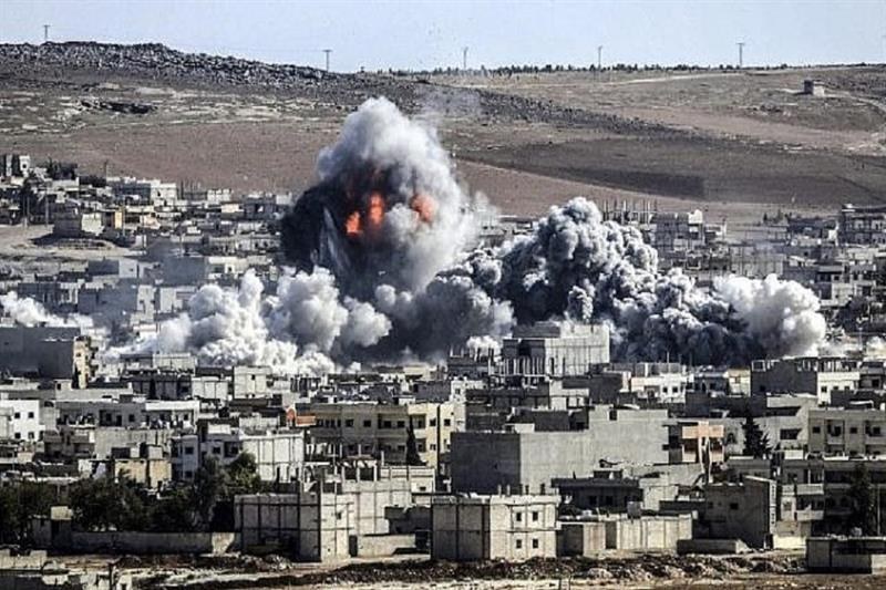 Smoke and flames rise over the Syrian border town of Kobani